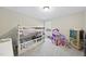 Bedroom featuring a bunk bed, a dollhouse, and a window at 239 Hopper Cir, Clayton, NC 27520
