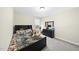 Bedroom with a wood bed frame, dresser, and carpeted floors at 239 Hopper Cir, Clayton, NC 27520