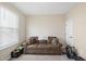 Bonus room with a brown couch and an exercise machine at 239 Hopper Cir, Clayton, NC 27520