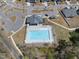 Aerial view of the community pool, featuring ample seating and a nearby parking area at 239 Hopper Cir, Clayton, NC 27520