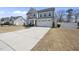 A lovely home featuring a two-car garage and a spacious concrete driveway at 239 Hopper Cir, Clayton, NC 27520