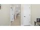 Inviting hallway with modern floors and neutral-toned walls leads into the home's living spaces at 239 Hopper Cir, Clayton, NC 27520