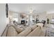 Comfortable living room featuring a cozy fireplace, a large television, and plush seating, perfect for relaxation at 239 Hopper Cir, Clayton, NC 27520