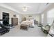 Spacious main bedroom with tray ceiling, sitting area, and serene decor, creating a relaxing retreat at 239 Hopper Cir, Clayton, NC 27520
