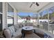 Screened-in patio with comfortable seating, a ceiling fan, and a backyard view at 239 Hopper Cir, Clayton, NC 27520