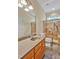 Bathroom featuring a stone countertop vanity, shower with glass door, and stone tile flooring at 2550 Bittersweet Dr, Durham, NC 27705