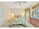 Inviting bedroom with a comfortable queen-size bed, floral curtains, and elegant decor at 2550 Bittersweet Dr, Durham, NC 27705
