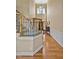 Gracious foyer featuring hardwood floors, a staircase, and decorative lighting at 2550 Bittersweet Dr, Durham, NC 27705