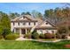 Stately two-story brick home with a landscaped front yard, covered porch and a charming balcony at 2550 Bittersweet Dr, Durham, NC 27705