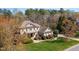 A two-story brick home features a manicured lawn and a brick walkway winding through lush landscaping at 2550 Bittersweet Dr, Durham, NC 27705