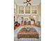 An expansive living room with an ornate decorative carpet and a three-story balcony at 2550 Bittersweet Dr, Durham, NC 27705
