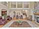 Grand living room with high ceilings and dark wood accents and a decorative fireplace at 2550 Bittersweet Dr, Durham, NC 27705