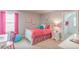 bedroom featuring a bed with colorful bedding, side table with lamp, and paintings at 262 Cardovia Way, Wendell, NC 27591