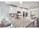 Modern kitchen with granite countertops, an island with seating, and stainless steel appliances at 262 Cardovia Way, Wendell, NC 27591