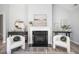 Cozy living room area featuring a fireplace, stylish decor, and views of the kitchen at 262 Cardovia Way, Wendell, NC 27591