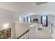 View of an upstairs loft area with white walls, carpeted floor, and an area for office, tv, games, and relaxing at 262 Cardovia Way, Wendell, NC 27591