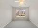 Bedroom featuring a window, carpet flooring and a ceiling fan at 2621 Wellington Ridge Loop, Cary, NC 27518