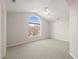 Spacious bedroom featuring a large arched window, carpet flooring and a ceiling fan at 2621 Wellington Ridge Loop, Cary, NC 27518