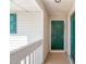 Condo doorway with a green painted door, with white trim and railings at 2621 Wellington Ridge Loop, Cary, NC 27518
