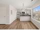 Eat-in kitchen with stainless steel appliances and wood-look flooring at 2621 Wellington Ridge Loop, Cary, NC 27518