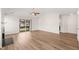 Spacious living room with fireplace, wood-look floors, and sliding glass doors to the patio at 2621 Wellington Ridge Loop, Cary, NC 27518