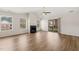 Bright living room featuring vaulted ceilings, a fireplace, and sliding glass doors to the outside at 2621 Wellington Ridge Loop, Cary, NC 27518