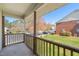 Relaxing patio with wooden railing, offering a serene view of the surrounding greenery and neighborhood at 2621 Wellington Ridge Loop, Cary, NC 27518