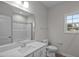 Bathroom featuring a white vanity, single sink, and tiled shower/tub combo at 275 Cardovia Way, Wendell, NC 27591