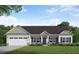 Beautiful single-story home with a manicured lawn, two-car garage and stone accents at 275 Cardovia Way, Wendell, NC 27591