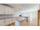 Gourmet kitchen with granite countertops, stainless steel appliances, and a large island at 275 Cardovia Way, Wendell, NC 27591