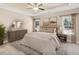 Inviting primary bedroom featuring a tray ceiling, neutral carpet and ample natural light at 275 Cardovia Way, Wendell, NC 27591