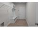 Functional mudroom includes storage bench, coat hooks, and wood-look flooring at 275 Cardovia Way, Wendell, NC 27591