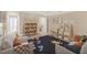 Bright playroom featuring a cozy seating area, bookshelves, and a playful footprint rug at 275 Cardovia Way, Wendell, NC 27591