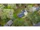 Aerial view of a charming home nestled among mature trees, set on a spacious lot at 2820 Mattlyn Ct, Raleigh, NC 27613