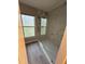 Bathroom features a glass shower with marble tile and a window with a floral privacy film at 2820 Mattlyn Ct, Raleigh, NC 27613
