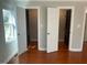 Spacious walk-in closets featuring custom shelving and hardwood floors, offering ample storage at 2820 Mattlyn Ct, Raleigh, NC 27613