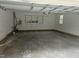 Spacious garage with room for two cars and additional storage space on built in shelving at 2820 Mattlyn Ct, Raleigh, NC 27613