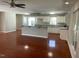 Open concept kitchen featuring an island, granite countertops, white cabinets and hardwood floors at 2820 Mattlyn Ct, Raleigh, NC 27613