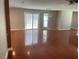 Spacious living room with hardwood floors, natural light and a sliding door leading to the backyard deck at 2820 Mattlyn Ct, Raleigh, NC 27613