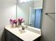 Bathroom featuring a vanity with flower decor, a large mirror, and neutral wall paint at 2918 Balbardie Dr, Apex, NC 27502