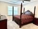 Spacious bedroom features a four-poster bed, ceiling fan, and plenty of natural light at 2918 Balbardie Dr, Apex, NC 27502