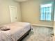 Cozy bedroom featuring a comfortable bed, neutral walls, and carpet flooring at 2918 Balbardie Dr, Apex, NC 27502