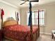A bedroom featuring a four-poster bed with decorative fabric accents and a ceiling fan at 2918 Balbardie Dr, Apex, NC 27502