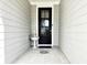 Charming front porch with a stylish entrance door and a decorative water feature at 2918 Balbardie Dr, Apex, NC 27502