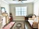 Bright and airy office space with a large window and decorative fireplace at 2918 Balbardie Dr, Apex, NC 27502