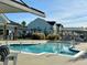 A resort-style community pool with clear blue water and seating areas in a neighborhood at 2918 Balbardie Dr, Apex, NC 27502
