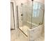 Modern shower featuring marble tile, glass enclosure, and a built-in bench at 2918 Balbardie Dr, Apex, NC 27502