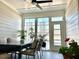 Bright sunroom filled with natural light, plants, and an inviting dining area at 2918 Balbardie Dr, Apex, NC 27502