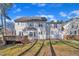 Charming two-story home featuring a spacious backyard and a wooden deck, perfect for outdoor living and entertaining at 3 Guilder Cv, Durham, NC 27713