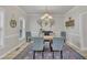 Dining room boasts a chandelier, window, and classic decor at 3 Guilder Cv, Durham, NC 27713